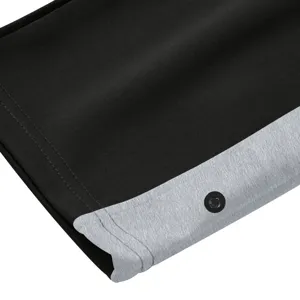 Heren casual sport knoop broek detail weergave, zwart en grijs kleurenblok recht been.