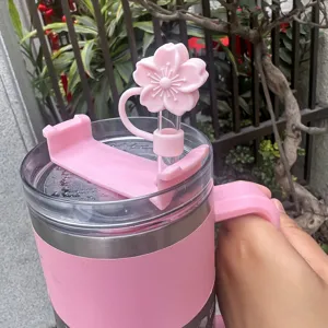 Pink cherry blossom silicone straw cover and lid accessory detail for tumbler cup decoration.