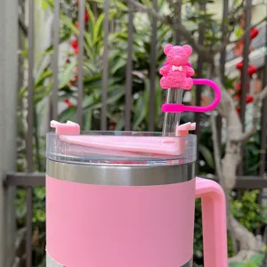 Pink insulated tumbler with cute bow bear straw cover silicone smiley straw cap detail view
