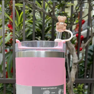 Pink insulated tumbler with cute bow bear straw topper, 10mm silicone dustproof straw cover.