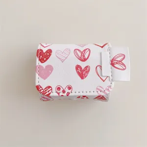 Leather AirPods case featuring cute red sketch heart print, durable protective cover detail.