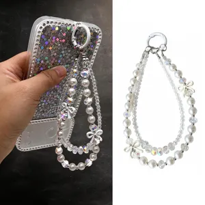 Crystal pearl bow phone strap, double-layer beaded lanyard charm for phone case decoration.