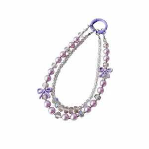 Detailed view of the double-chain crystal phone charm with purple pearls and cute bows.