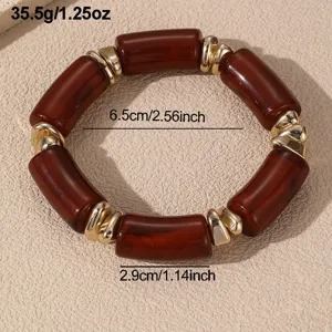Klobiges braunes Harz und goldenes Perlenarmband, Statement Stil elastischer Modeschmuck.