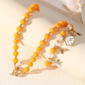 Sommer Strand Ozean Stil Perlen Halskette Armband Set mit Muschel und Seestern Anhänger Detail.