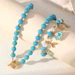 Sommer Ozean Stil Perlen Schmuck Detail, blaue Perlen mit Muschel und Seestern Anhängern.