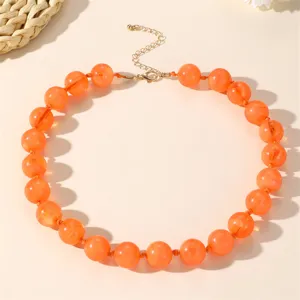 Chic collana statement con perline in acrilico arancione stile bohémien da donna.