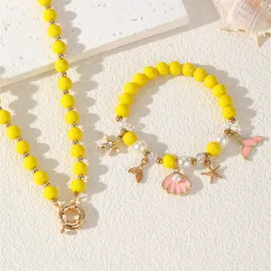 Sommer Strand Ozean Stil gelbe Perlen Halskette und Armband Set mit Muschel Stern Anhängern.