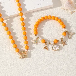 Sommer Strand Ozean Stil orange Perlen Halskette und Armband Set mit Muschel Stern Charm.