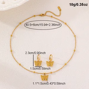 Goldener Schmetterling Halskette und Ohrringe Schmuckset aus Edelstahl, feine Detailansicht.