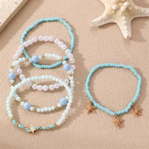 Σετ boho βραχιόλια παραλίας με χάντρες και αστερίες, ιδανικό για τις καλοκαιρινές σας διακοπές.