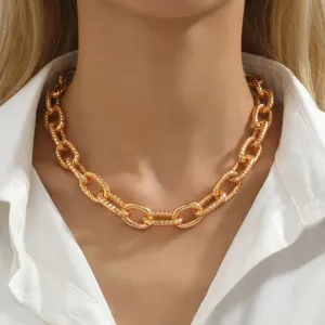 Chunky gold chain necklace for women, bold statement metal O-chain choker jewelry piece.