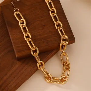 Chunky gold chain necklace for women, statement oversized O-link metal jewelry detail view.