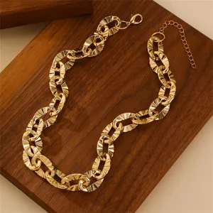 Gold chunky chain necklace close-up, featuring textured O-links and an adjustable extension.