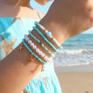 Σετ βραχιόλια με χάντρες παραλίας boho με χρυσά charms αστερία για γυναίκες.