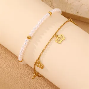 Elegantes mehrlagiges Perlen und Kronen Anhänger Armband oder Fußkettchen für Damen.