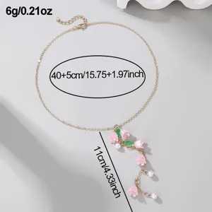 Gold Y-shaped necklace featuring pink bell orchid pendants and delicate pearls for women.