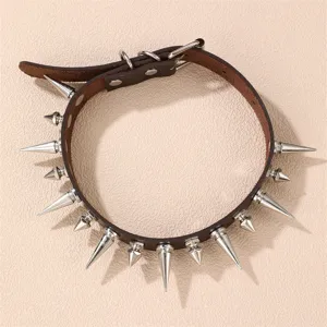 Detailed shot of a brown leather spiked choker collar with metal silver rivets and ring buckle.