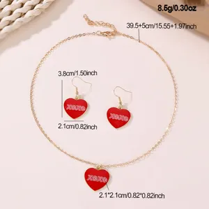 Charming red heart XOXO necklace and earrings set, elegant gold tone fashion jewelry gift for women.