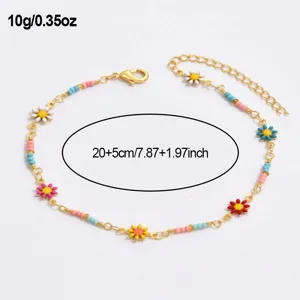 Close-up detail of the colorful daisy beaded anklet, showing delicate alloy chain and enamel floral charms.