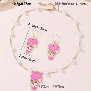 Pink heart hot air balloon pendant necklace and earrings set with white pearls for women.