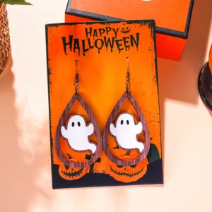 Detailed view of Halloween ghost teardrop earrings on a festive orange display card