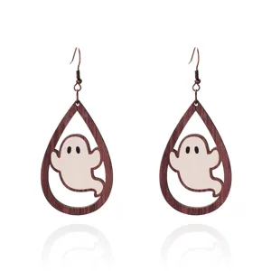 Detail view of Halloween wooden teardrop drop earrings with a cute cartoon ghost cutout