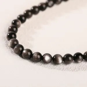 Natural silver sheen obsidian round beaded bracelet showing beautiful cat-eye effect