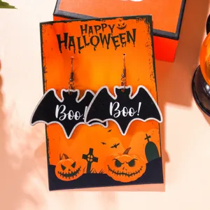 Detailed view of funny Halloween bat earrings with a festive orange display card.
