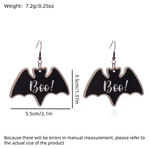 Close-up detail of Halloween bat earrings showing precise dimensions and weight measurements