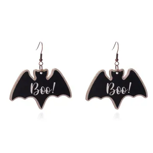 A pair of black Halloween bat drop earrings with detailed white Boo text printed.