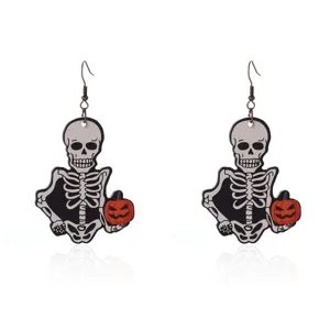 Detailed view of quirky Halloween skeleton and pumpkin dangle earring accessories