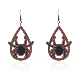 Detailed view of Halloween wooden spider teardrop earrings with rustic bronze metal hooks