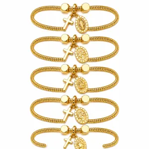 Bracciale catena serpente dorato con ciondoli croce e medaglia religiosa da donna.