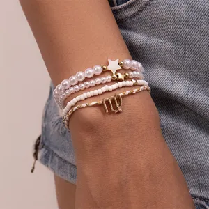 Mehrlagiges Perlenarmband mit Sternanhänger und Sternzeichen für Damen modischer Alltagsschmuck.
