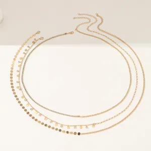 Exquisite multi-layer gold waist chain set with sparkling rhinestones and shiny discs.