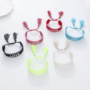 Woven friendship bracelet with LOVE embroidery and cute tassels, multi-color casual wristband jewelry.