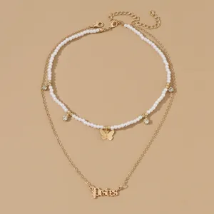 Doppelreihige Modeschmuck-Halskette mit Perlen, Strass, Schmetterling und Anhänger.