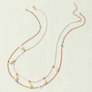 Catena da corpo multistrato bohémien con conchiglie perle e perline malocchio per spiaggia