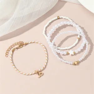 Schickes mehrlagiges Perlenarmband Set mit Sternzeichen Anhänger für Damen elegant.