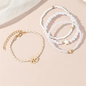 Mehrlagiges Sternbild Perlen Armband Set mit eleganten Perlen und wunderschönem Tierkreiszeichen.