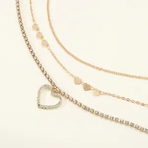 Detail shot of multi-layer rhinestone heart metal waist chain, fashion body jewelry accessory.