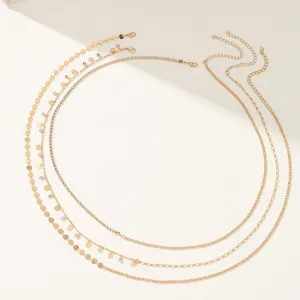 Gold waist chain set for women, layered belly chains with rhinestones and delicate discs.