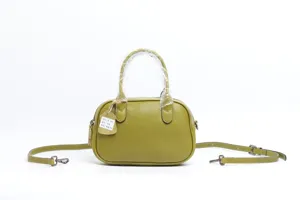 Green leather vintage shoulder crossbody bag, casual women's pillow handbag with strap.
