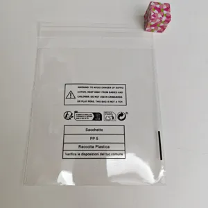 Transparent self-sealing plastic bag with compliance warning and recycling labels for packaging.