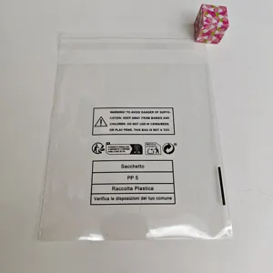 Transparent plastic self-sealing bag with compliance warning and recycling symbols for packaging.