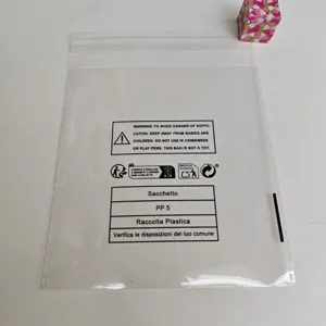 Transparent plastic self-adhesive packaging bag with safety warnings and recycling labels.