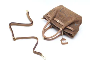 Vintage embossed leather handbag with shoulder strap for women, elegant retro tote bag.