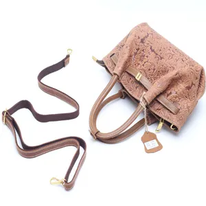 Vintage genuine cowhide embossed floral handbag with adjustable shoulder strap for women.