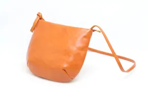 Detailed view of the premium vegetable tanned leather texture and fine strap craftsmanship.